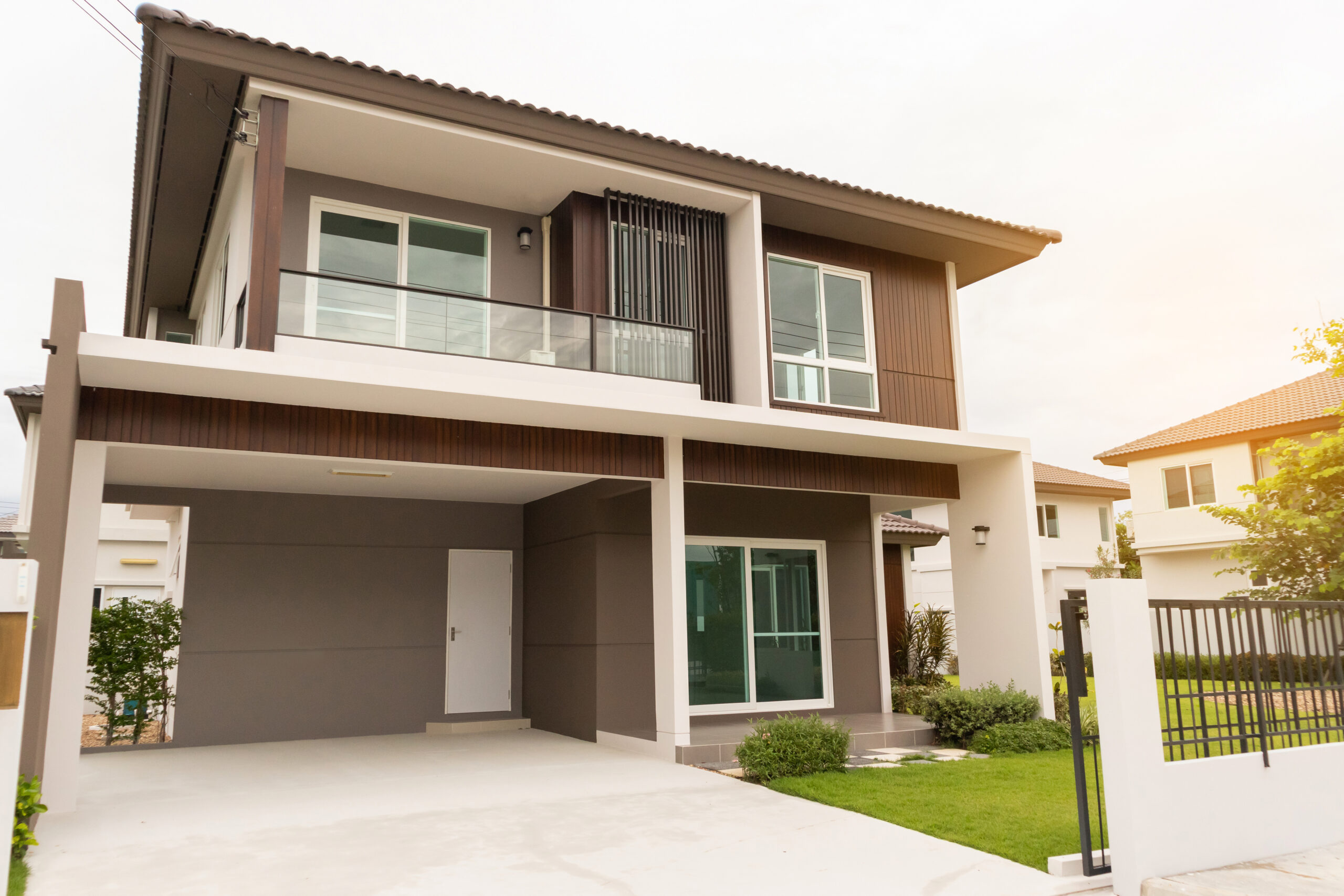 Beautiful modern house exterior with green grass